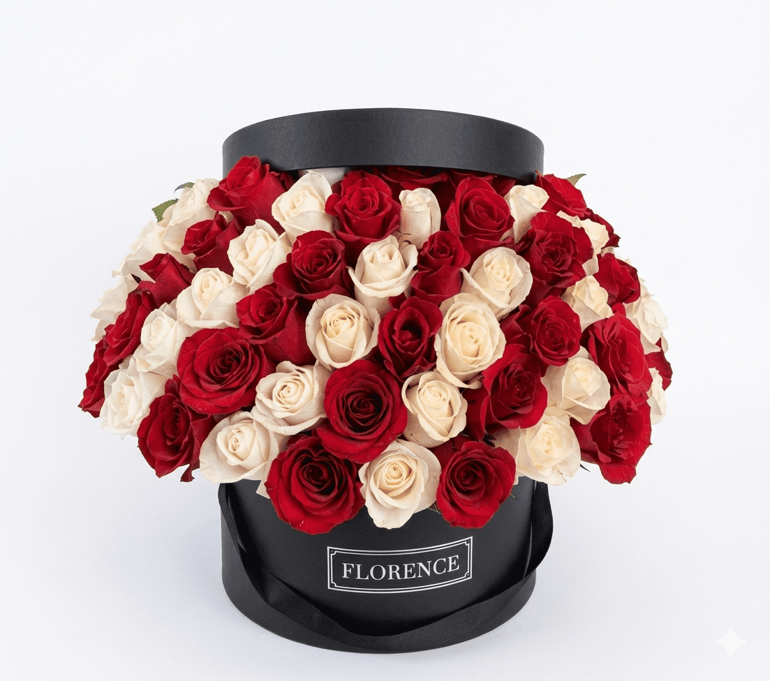 The Rare Love - Flower Box features a round black box labeled FLORENCE, filled with alternating rows of red and white roses—a stunning arrangement from Orange County Flowers.