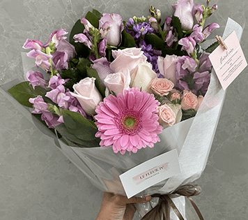 Flower arrangment made in Westminster, CA, Orange County, by Bolsa Florist, product is called Blissful - Wrapped Bouquet