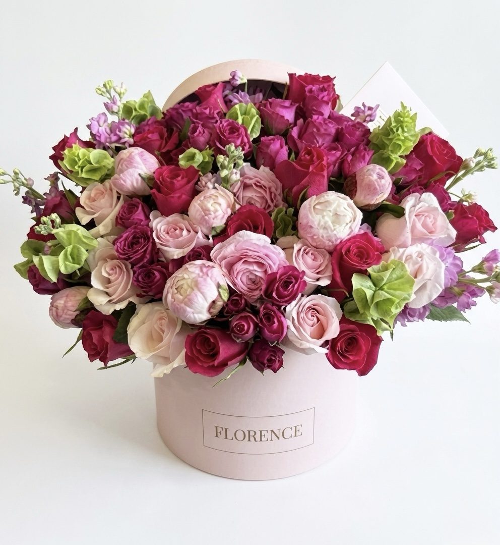 The "My Little Peony - Flower Box," a round pink box filled with lush pink, red, and pale green roses and peonies with greenery, highlights Orange County Flowers' elegance against a plain white background.