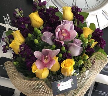 Flower arrangment made in Westminster, CA, Orange County, by Bolsa Florist, product is called Night & Day - Wrapped Bouquet