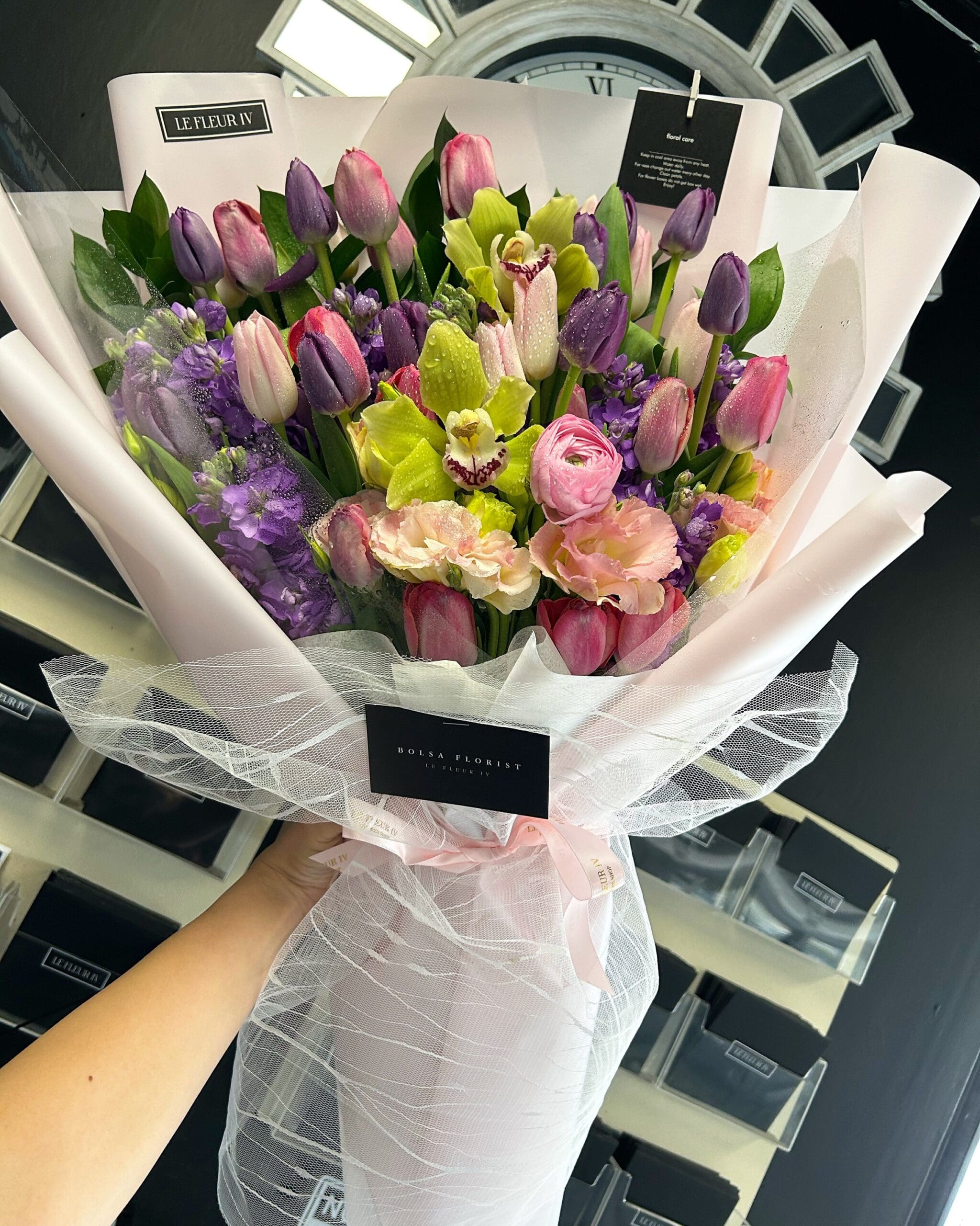 Flower arrangment made in Westminster, CA, Orange County, by Bolsa Florist, product is called Kissed by Tulips - Deluxe Wrap